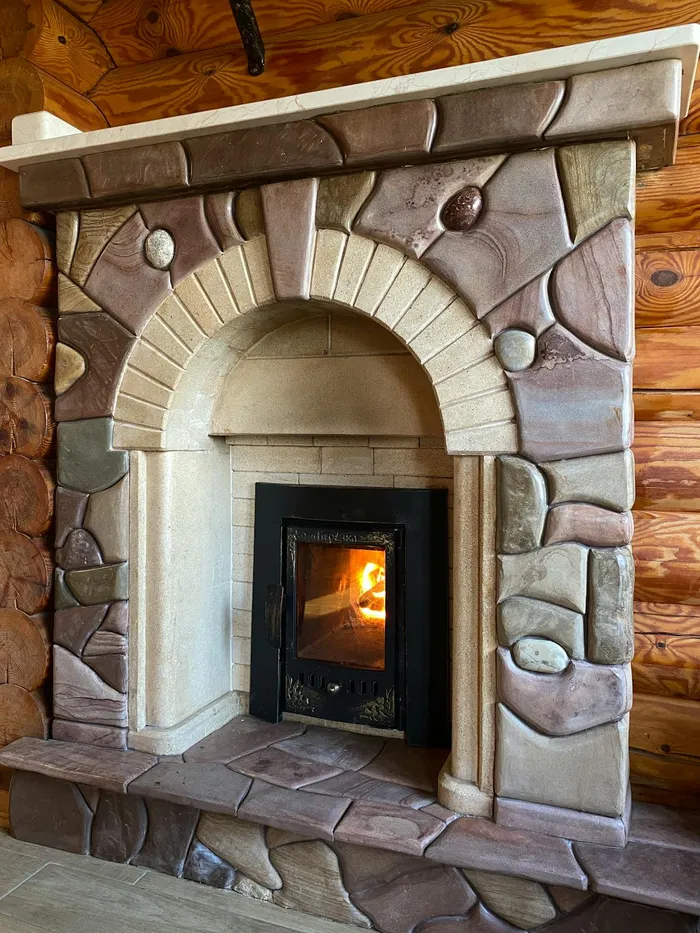 Stone fireplace with turf fire burning